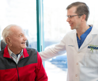 Dr. Aldridge speaking to Robert Heide hip replacement