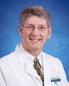 Dr. Swenson headshot on blue background