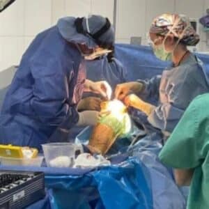 doctors preforming surgery operating room