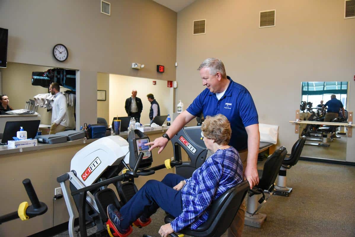 Hrosm-action-marc-forrest-5 Marc physical therapist with patient exercise therapy