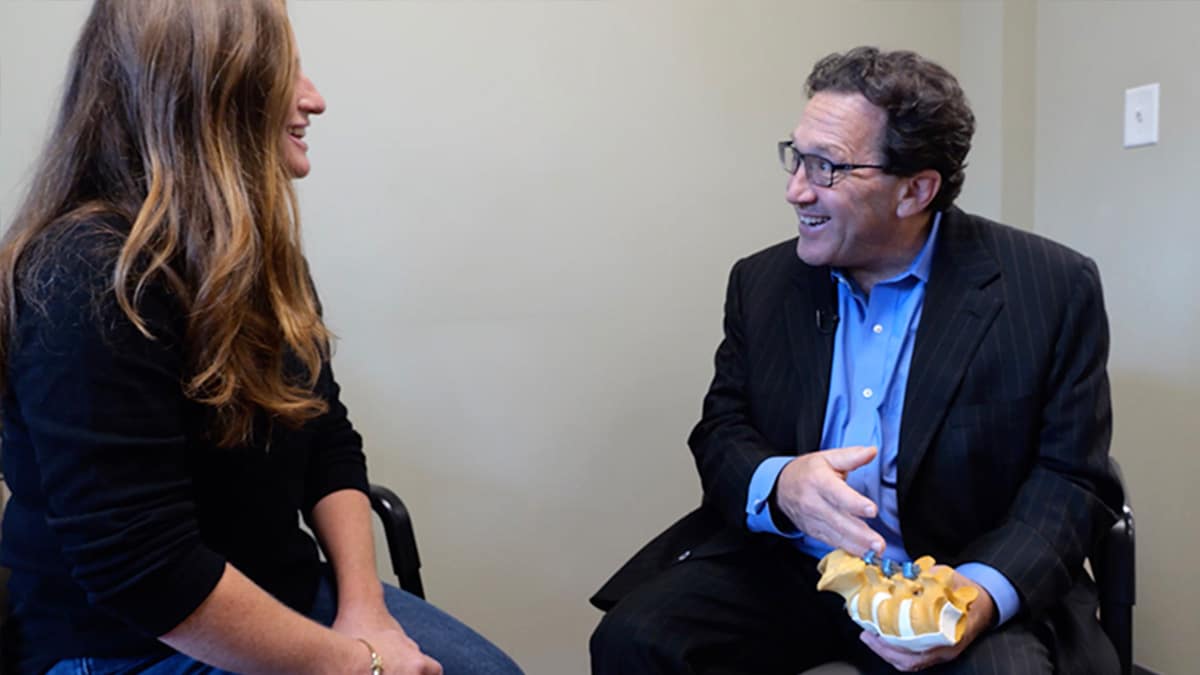 Kerner-patient-speaking-spine-care-web Dr. Kerner talking with patient in office