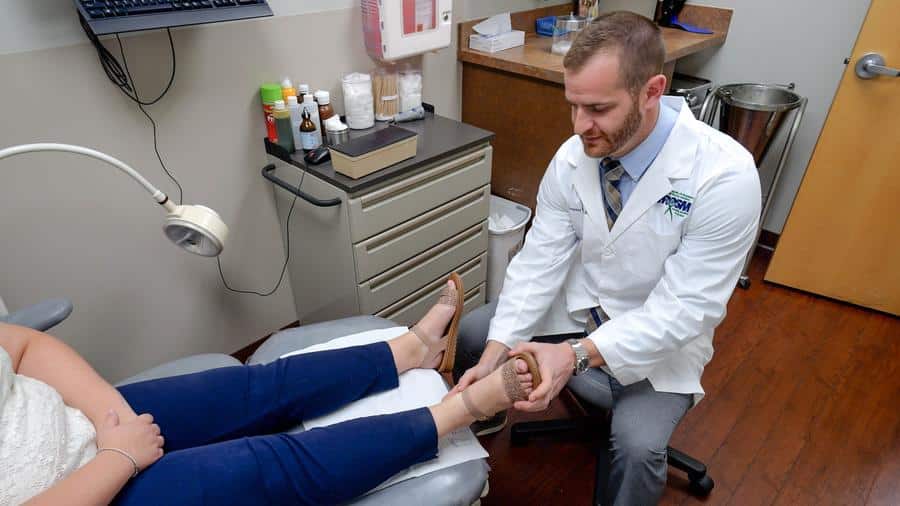 Dr. Dreikorn examining foot during podiatry appointment