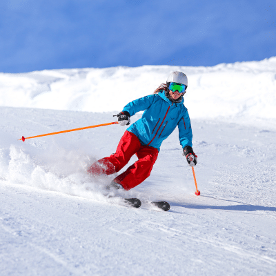 Winter sports safety tips: avoiding orthopaedic injuries 5 Person skiing down a snowy hill, representing winter sports safety tips