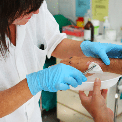 Healing faster after surgery: surgical wound care in hampton roads 2 A person in gloves giving an injection, representing surgical wound care in hampton roads