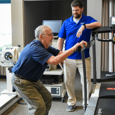 Non-opioid pain management: how to manage pain without relying on opioids 2 Chad carlson pt dpt, assisting older man in doing physical therapy exercises, representing non-opioid pain management